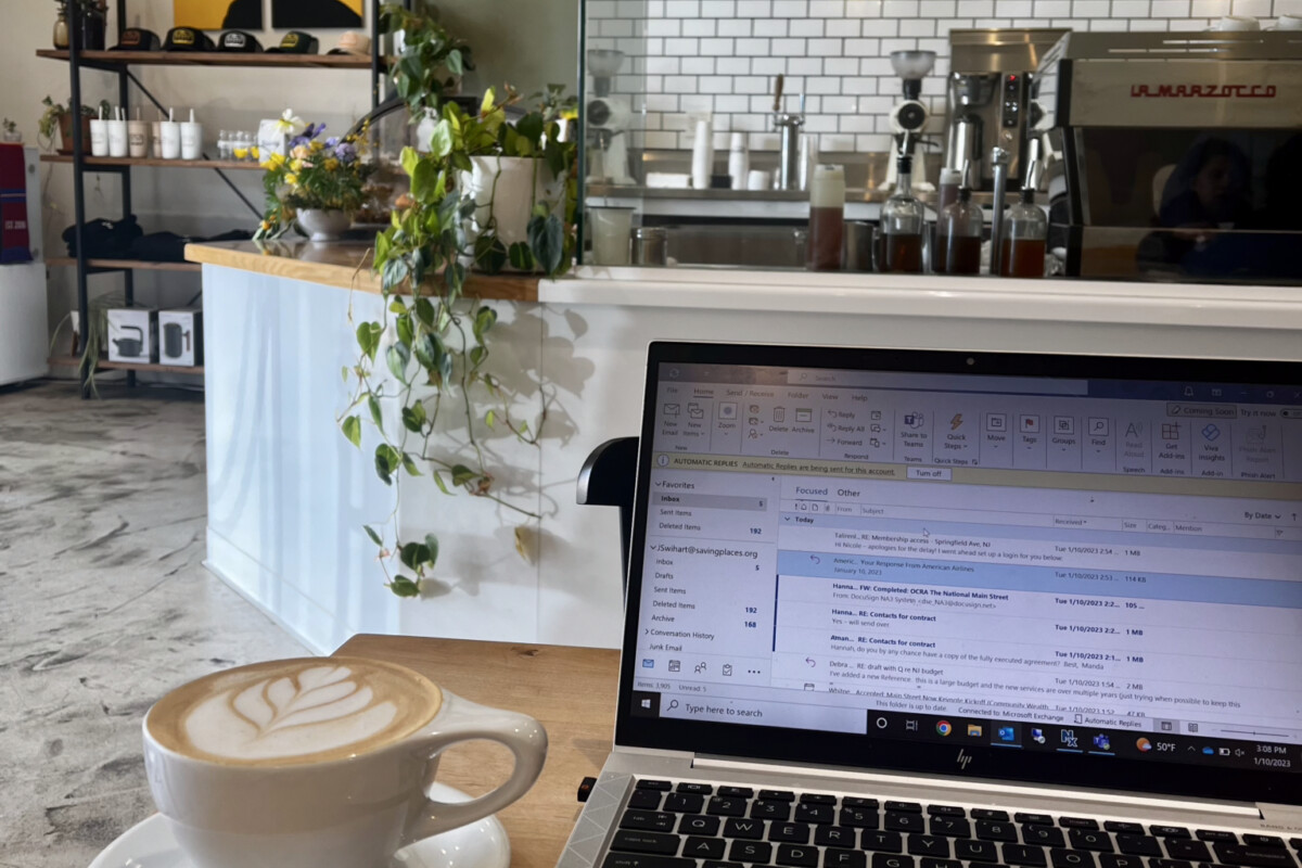 Remote workspace set-up in a modern coffee house.