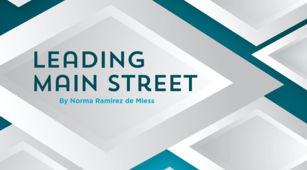 Graphic featuring overlapping white diamonds on a blue background. Text reads "leading main street"