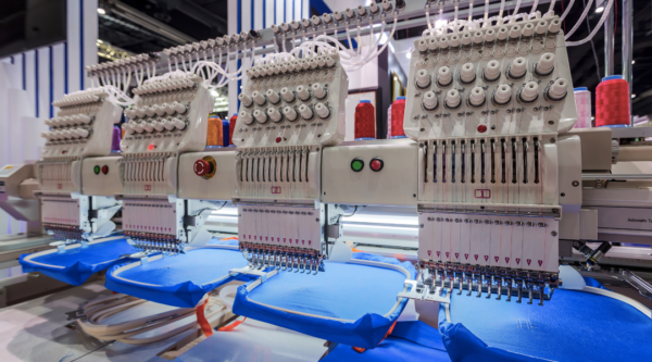 A line of industrial embroidery machines