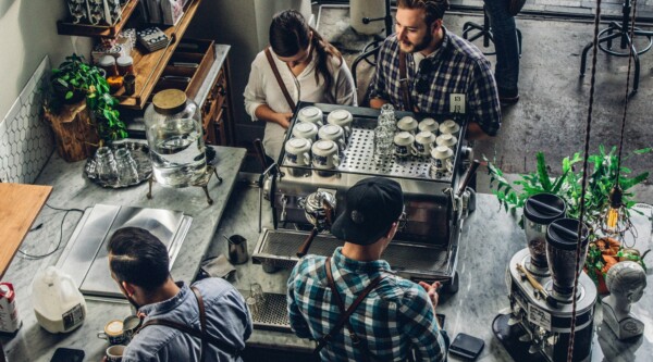 Overhead shot of people ordering coffee in a small cafe