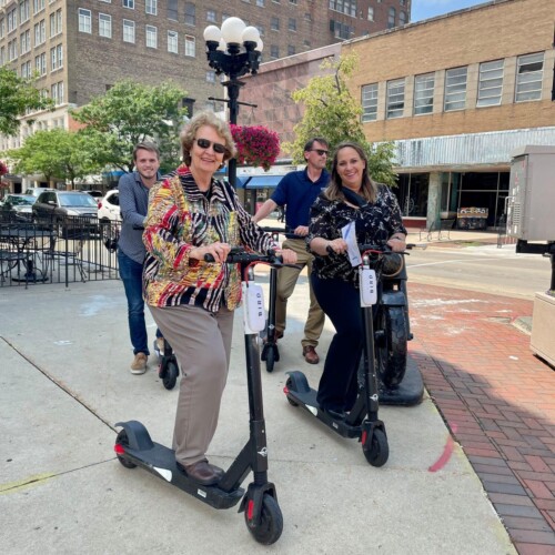 People riding e-scooters in Waterloo, Iowa