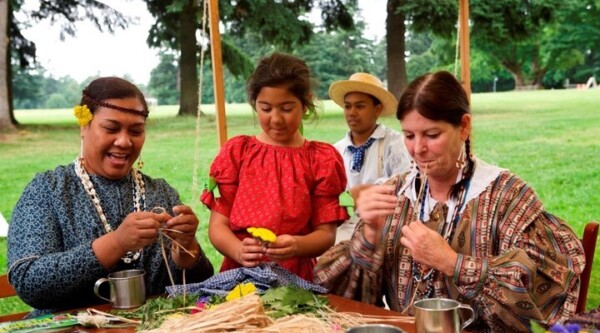 Volunteers portray Hawaiian workers at Fort Vancouver at Fort Vancouver National Historic Site's Brigade Encampment event