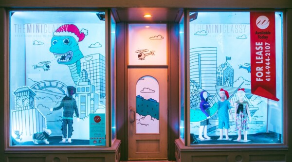 The display designed for The Mini Classy combines graphic elements from the retailer’s latest clothing line, an iconic Milwaukee skyline, and mannequins decked in The Mini Classy’s newest collection of apparel.