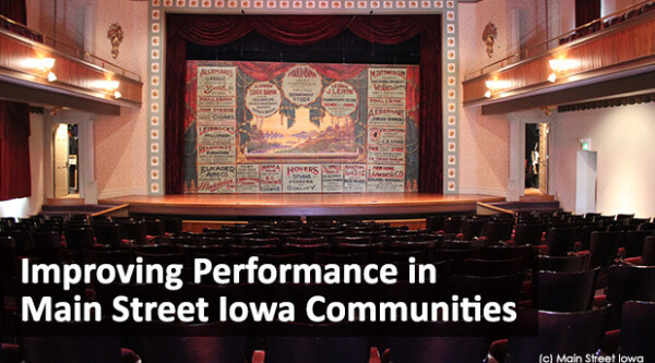 Interior of historic theater with text reading, "Improving Performance in Main Street Iowa Communities."