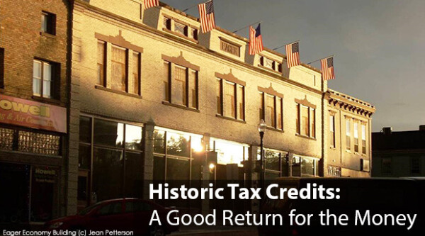 Exterior of historic downtown building at sunset, reading: "Historic Tax Credits: A Good Return for the Money."