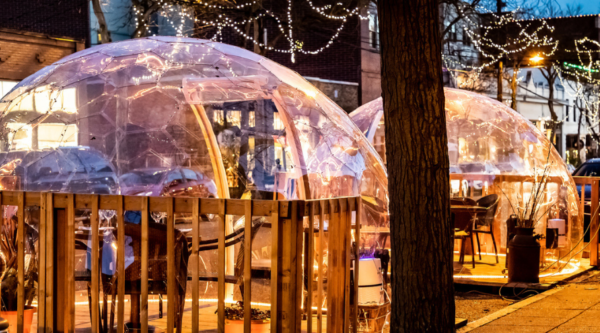 Outdoor dining with bubble tents