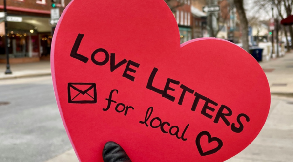 A read heart with text reading "love letters for local"