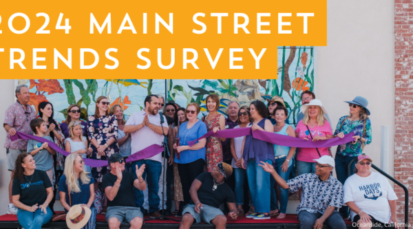2024 Main Street Trends Survey. People perform a ribbon cutting in front of a mural.