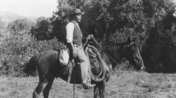 George McJunkin riding a horse