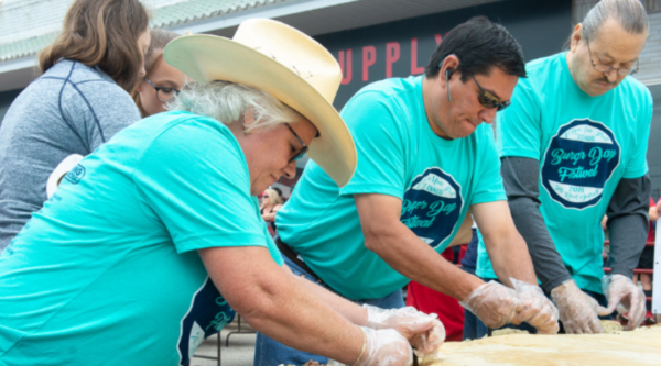 Governor Reggie W. Wassana (middle), Cheyenne & Arapaho Tribe, Lt Governor Gib Miles (back), Cheyenne & Arapaho Tribe, and County Court Clerk Marie Hurst (front), Canadian County, Oklahoma, volunteer at El Reno Main Street's Burger Day Festival.